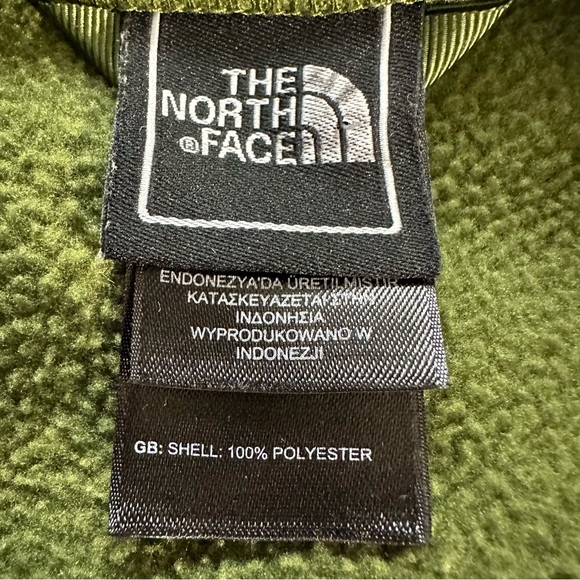 The North Face boys  full-zip fleece jacket in green with a neon yellow zipper. - Picture 4 of 6